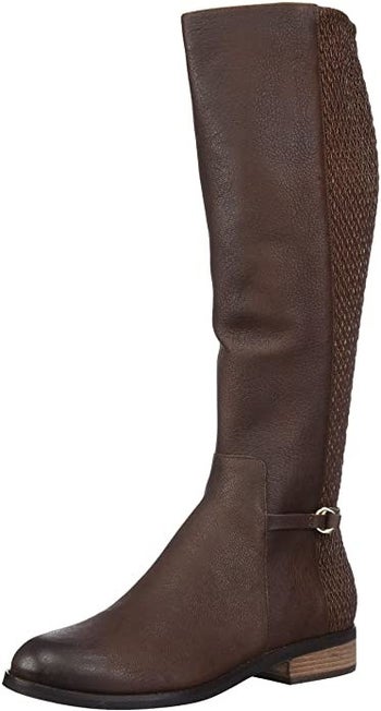 Knee-high riding boot with a small block heel and gold-tone hardware at the ankle 