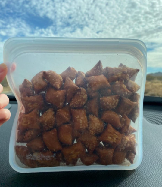Reviewer storing pretzels in the clear-front silicone bag