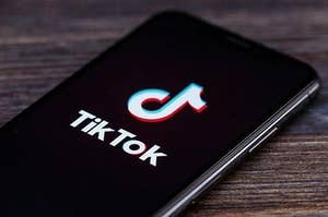 A phone with a TikTok logo on it