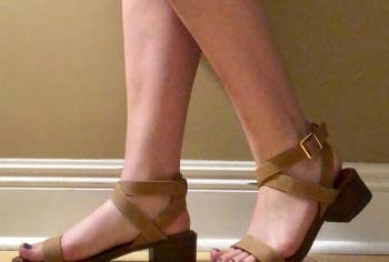 a reviewer photo of someone wearing the block heel sandals in brown 