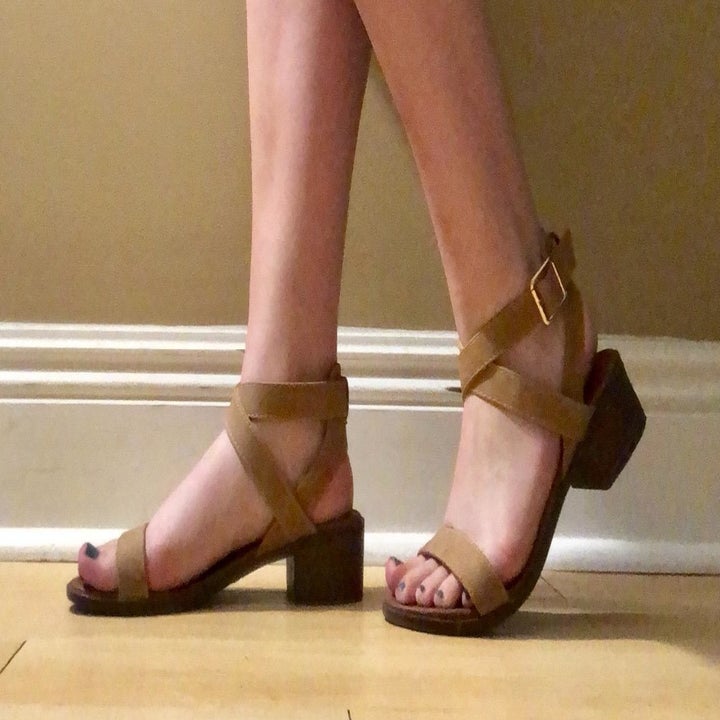 a reviewer photo of someone wearing the block heel sandals in brown 