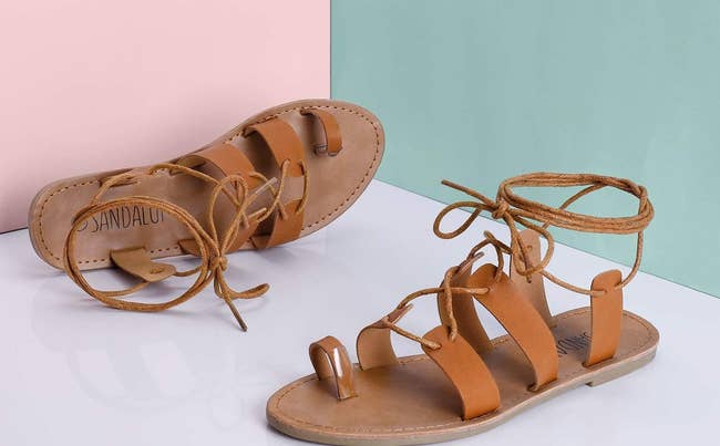 sandals on table with pink and teal backdrop