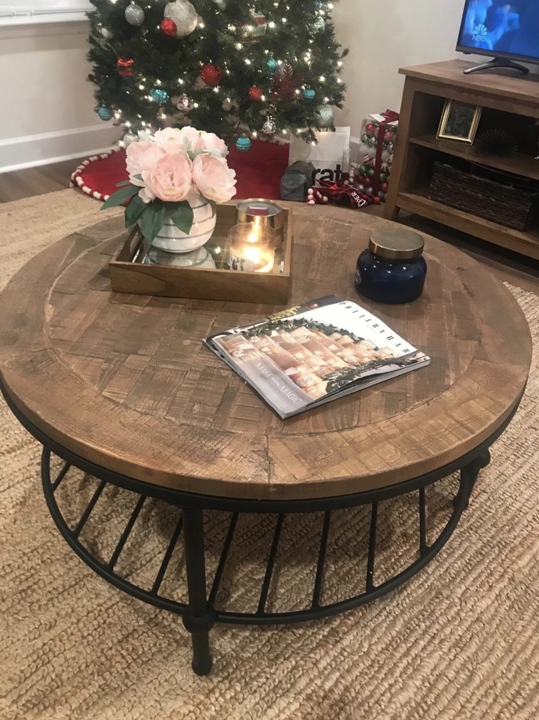 Coffee table with decor on top sitting in living room