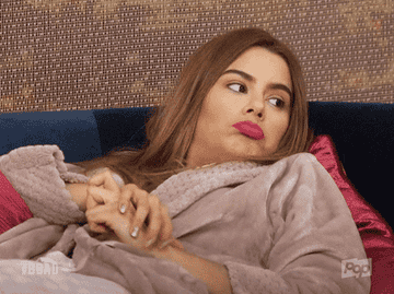 GIF from &quot;Big Brother After Dark&quot; of person in robe shrugging