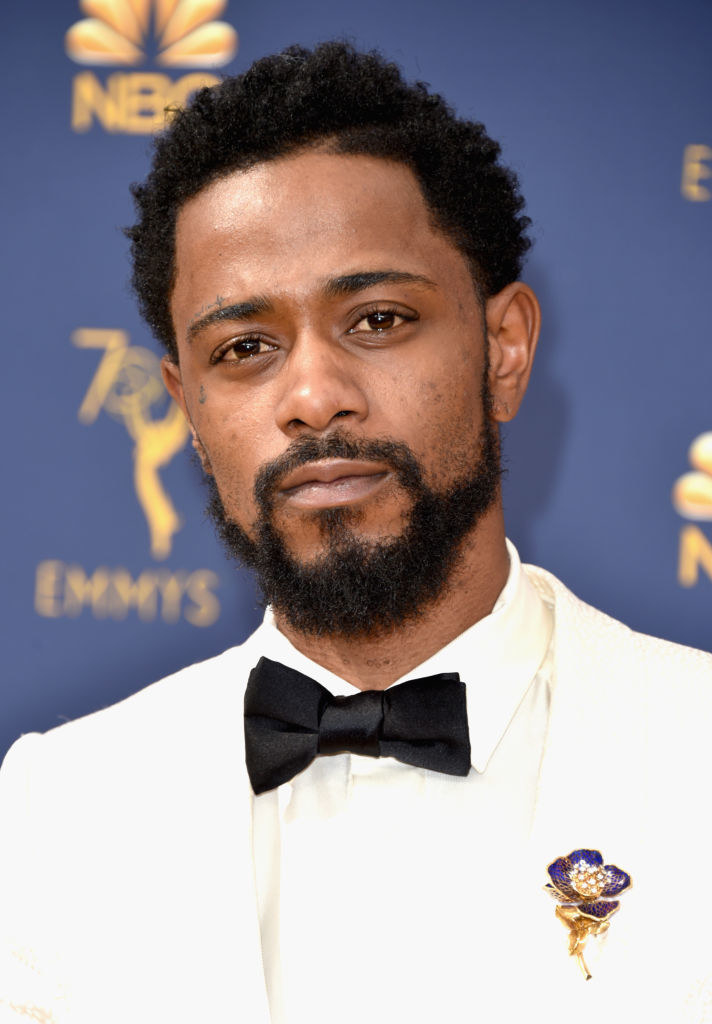  Lakeith Stanfield attends the 70th Emmy Awards at Microsoft Theater in a suit adorned with a jeweled flower brooch