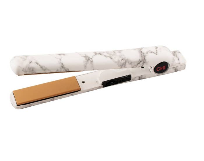 A white and black marbled-design ceramic flat iron