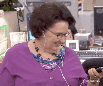 a gif of phyllis from the office with water being poured over her head
