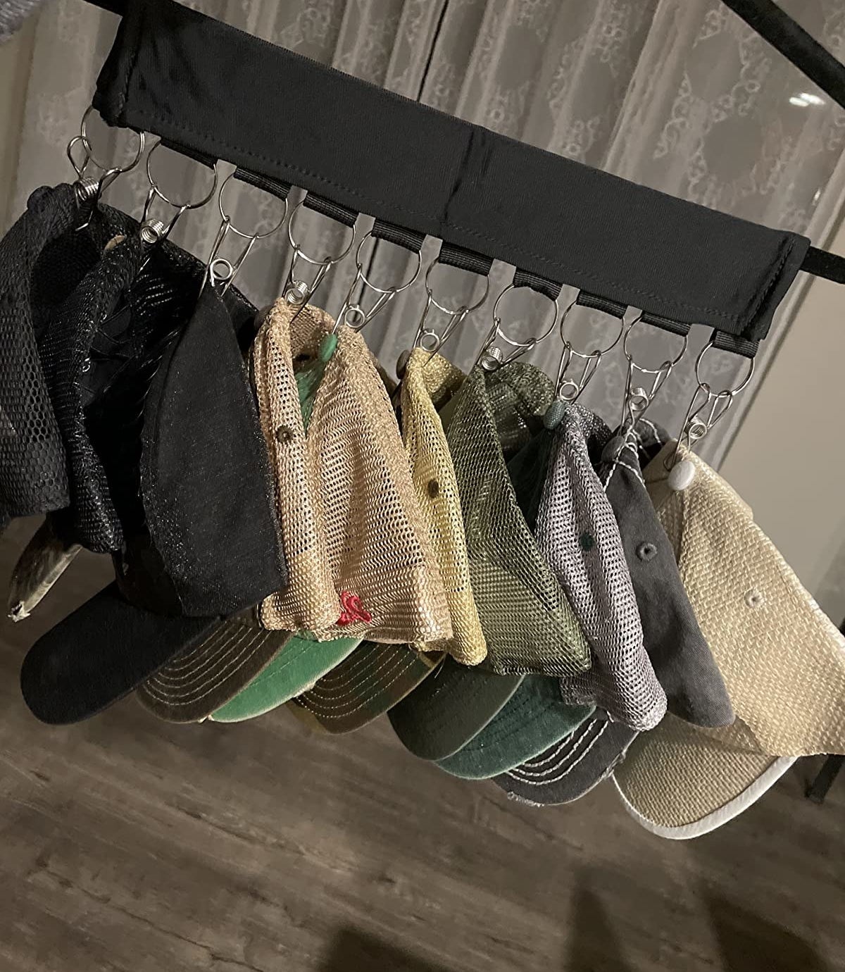 reviewer image of the hat organizer with neat stack of hats