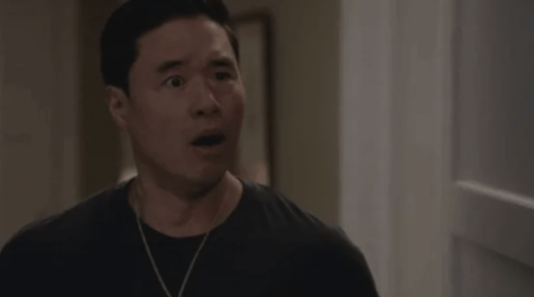 Randall Park with his jaw dropped