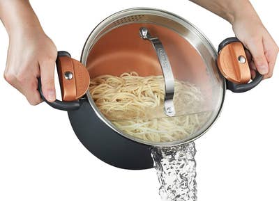The pot straining the pasta water