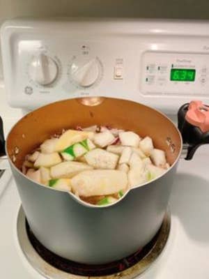 The pot with vegetables in it