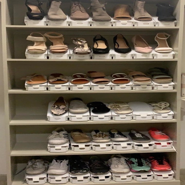 Reviewer image of their assortment of different shoes neatly arranged using the stackers