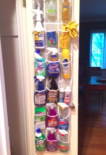 over the door plastic shoe organizer with cleaning supplies in it