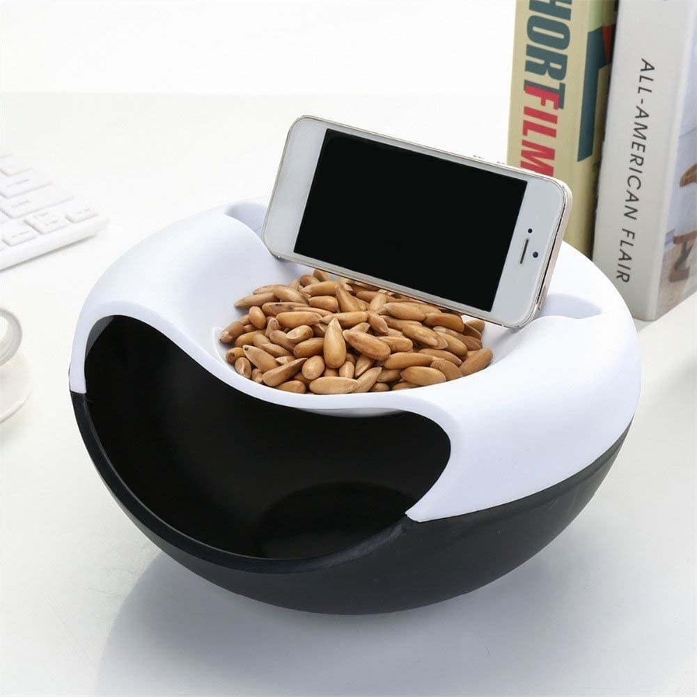 the phone propped on the bowl with almonds