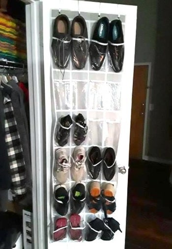 clear over the door shoe organizer with shoes in it
