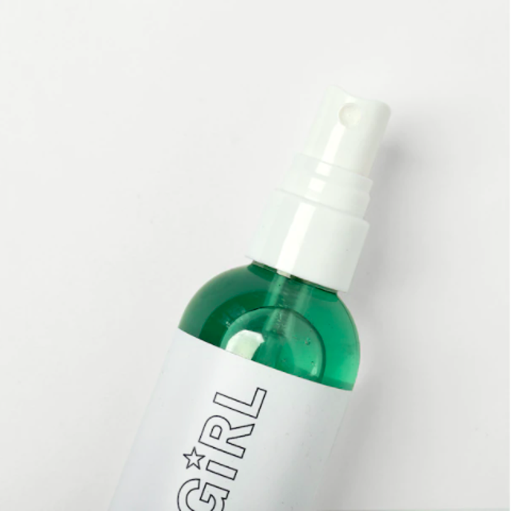 A close up of the spray bottle with the mist inside
