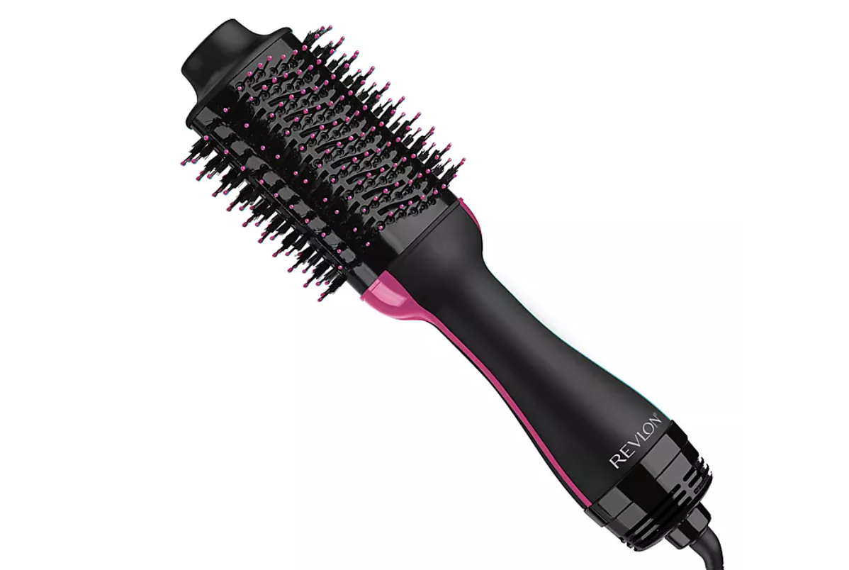 the hair dryer and volumizer brush in a pink and black shade