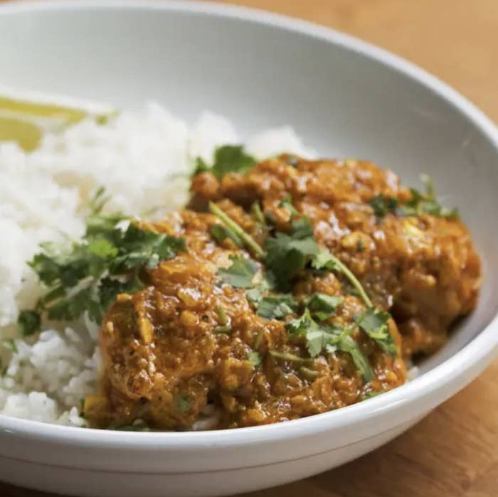 Curried chicken with white rice and cilantro 