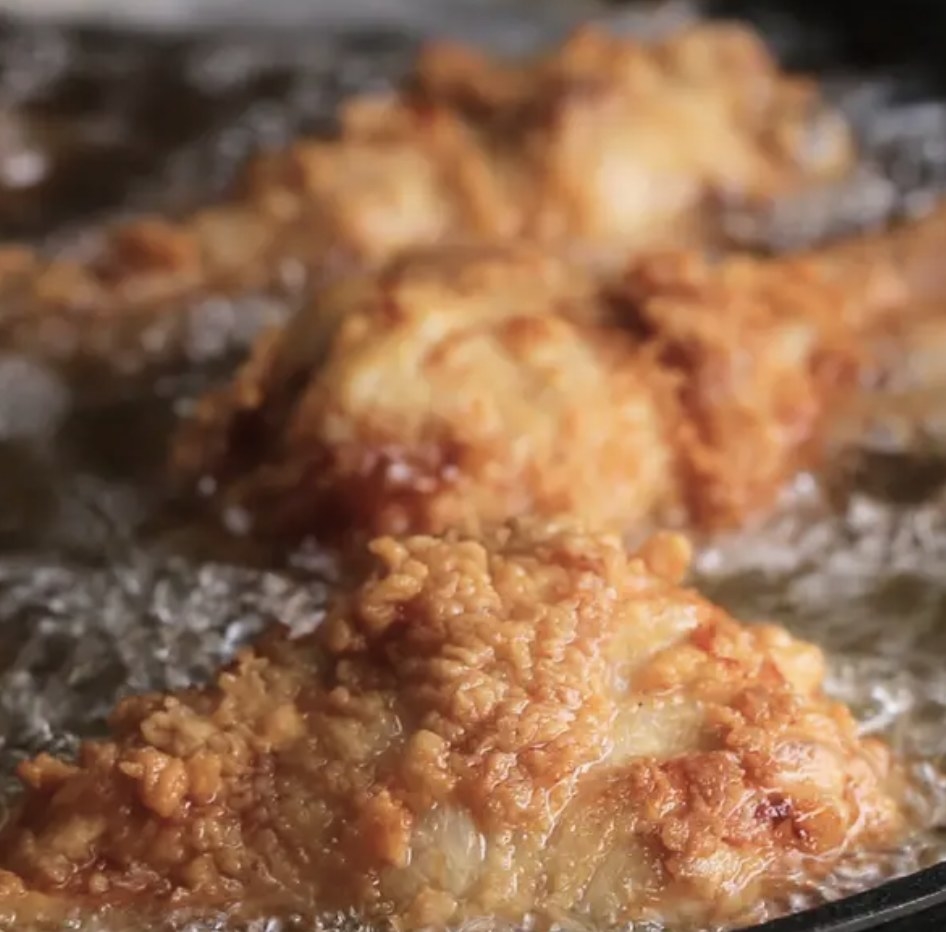 Chicken frying in a pan 