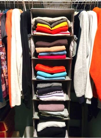 reviewer's hanging closet organizer with sweatshirts