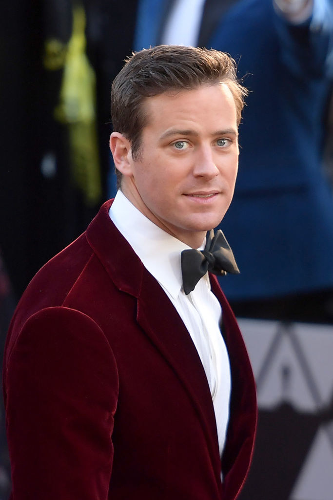 Armie at an event dressed in a velvet suit and bowtie
