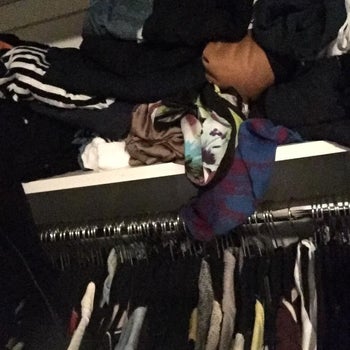 Reviewer image of a shelf full of stuffed clothes