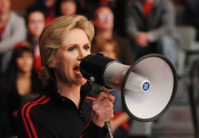 Sue yelling into a bullhorn