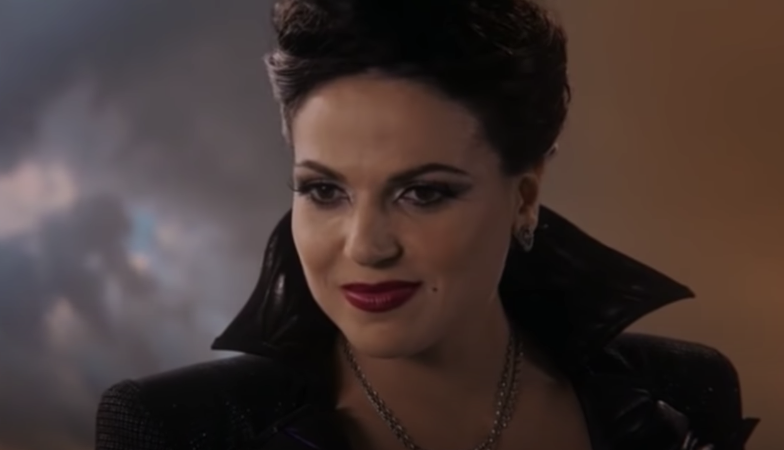 Regina as the evil queen grinning