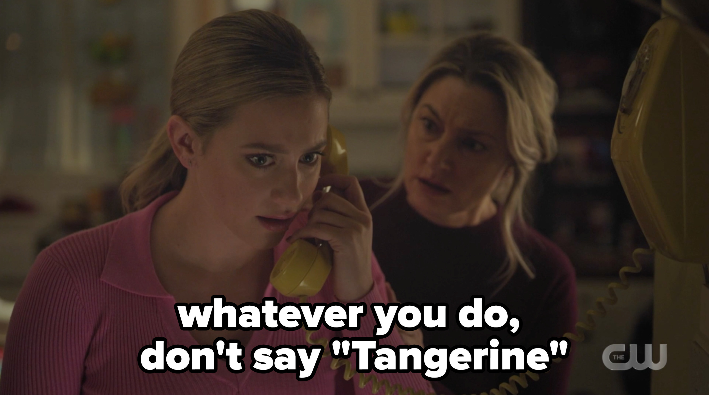 Betty on the phone with the caption &quot;whatever you do, don&#x27;t say tangerine&quot;