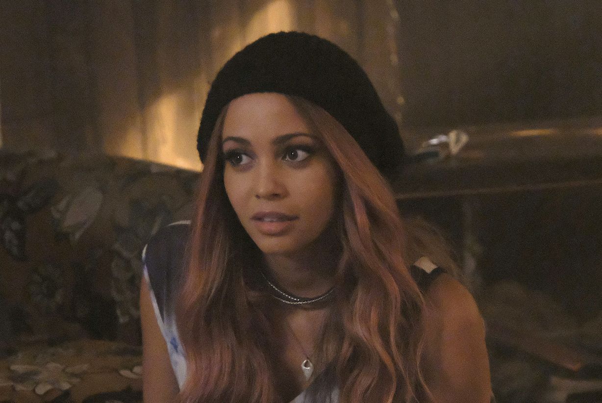 Toni wearing a beanie and looking in the distance