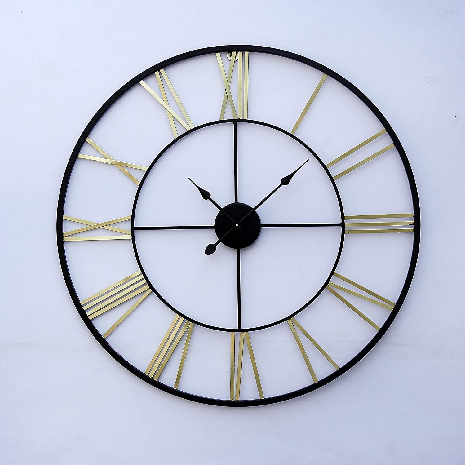 A clock with a black hands and rim, and golden Roman numerals