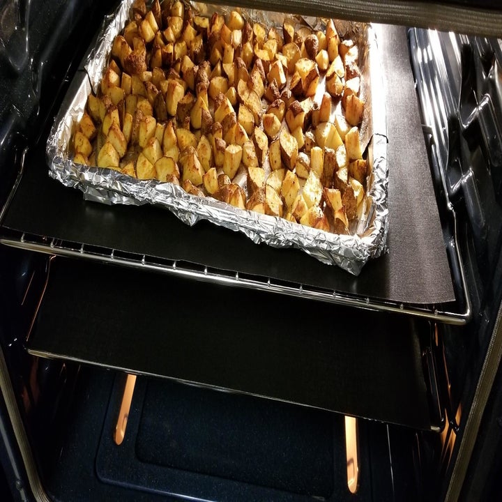 Reviewer photo of oven liners placed on racks