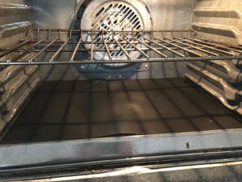 Reviewer's oven liner placed on bottom of oven