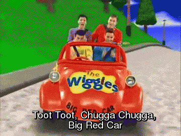 The four original Wiggles in a big red car with the caption &quot;toot too, chugga chugga big red car&quot; 