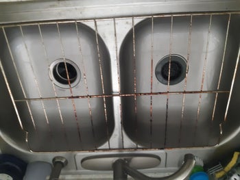 Reviewer photo of oven rack before using Green Miracle Cleaner