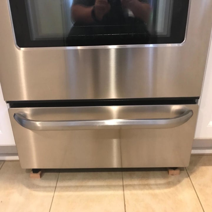 Reviewer photo of oven door after using stainless steel cleaner