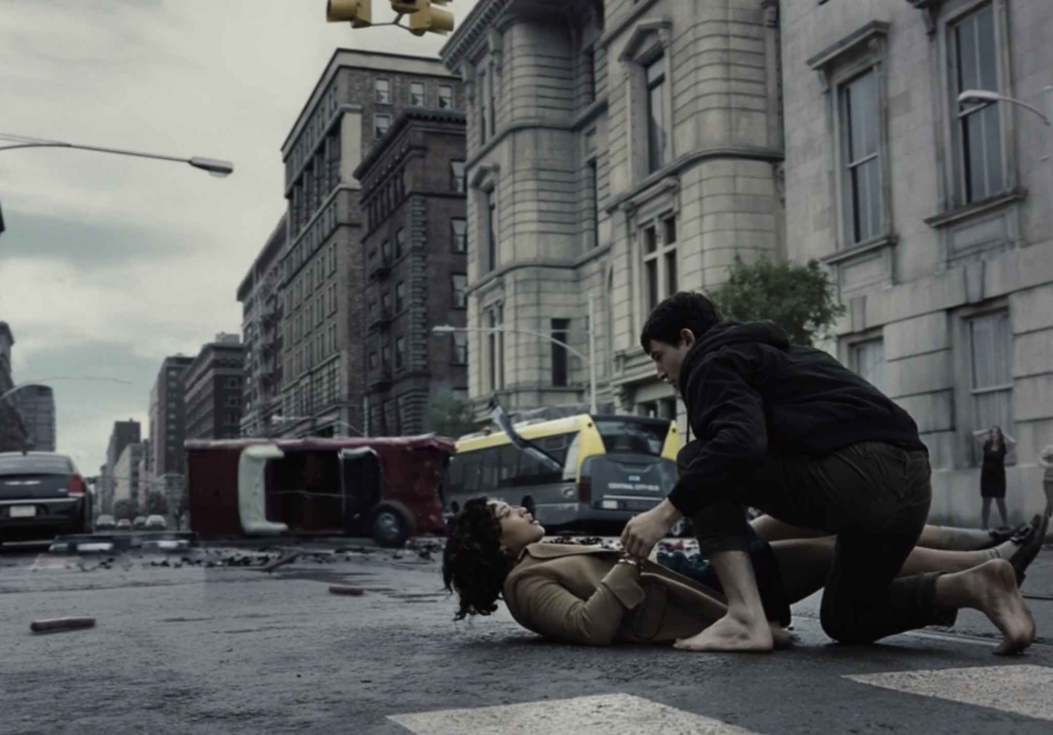 Barry leaning over Iris in the street after rescuing her
