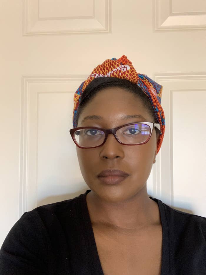 BuzzFeed editor Tafi Mukunyadzi wears the gorgeous orange and blue headwrap