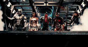 The Justice League walking to disembark 