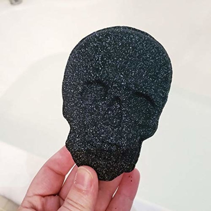 Black skull-shaped bath bomb