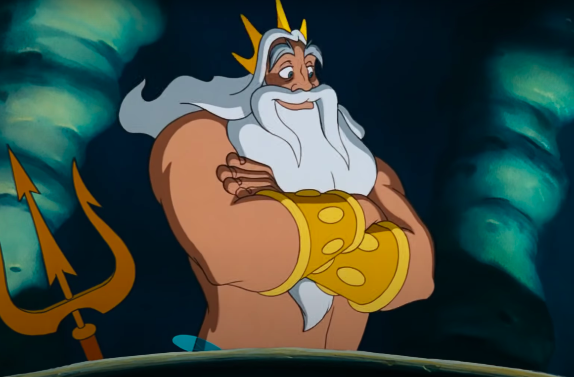 King Triton smiling with his arms crossed