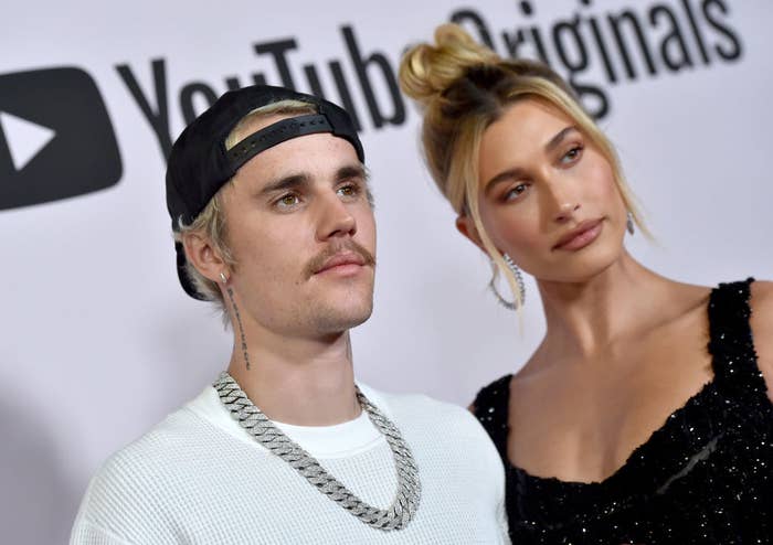 Hailey and Justin posing on a red carpet
