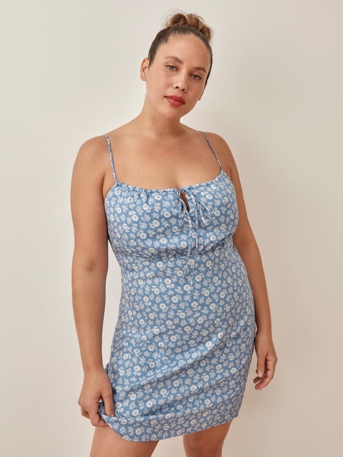 Model wearing the light blue and white floral dress