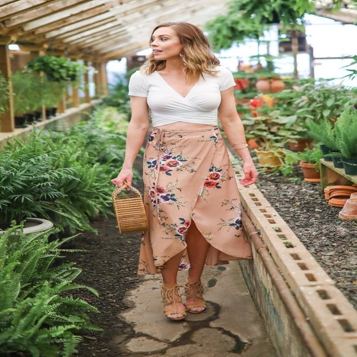 a different reviewer wearing the skirt with a white T-shirt