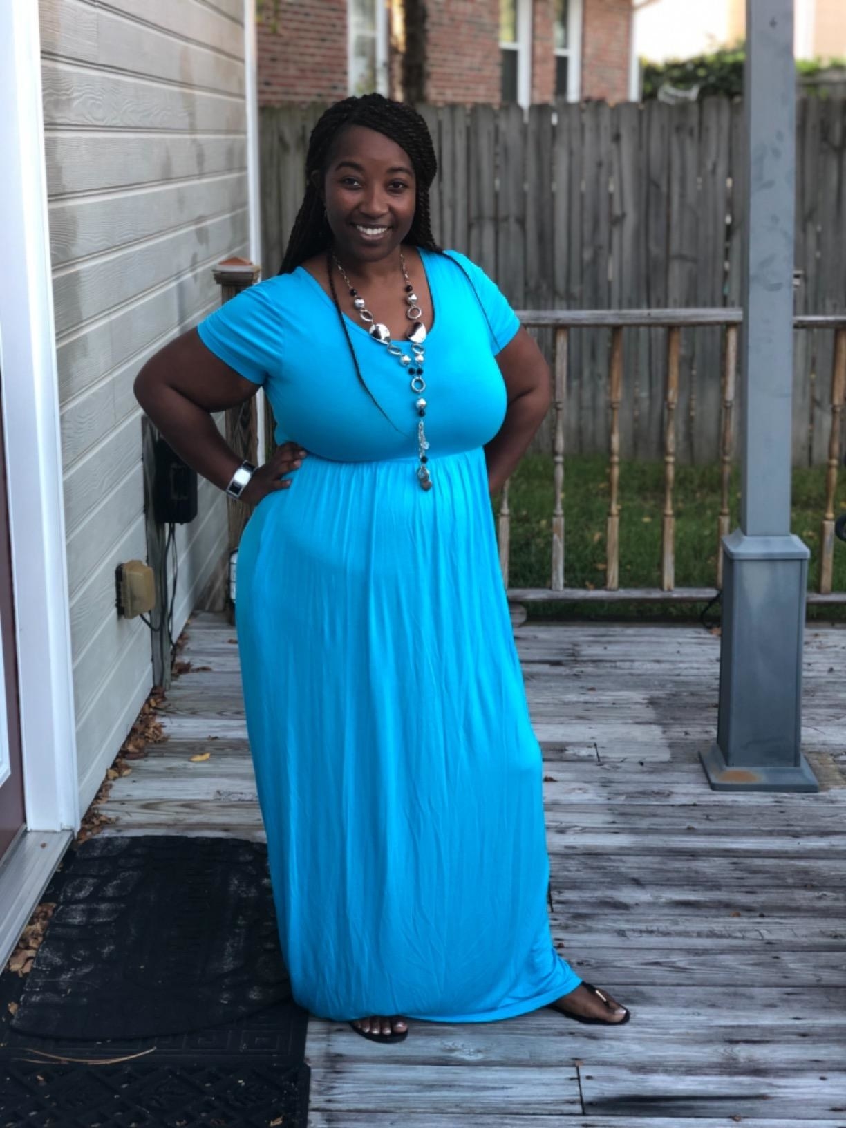Reviewer wearing the blue dress