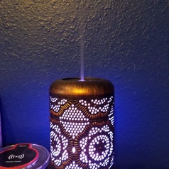 same essential oil diffuser with a purple glow