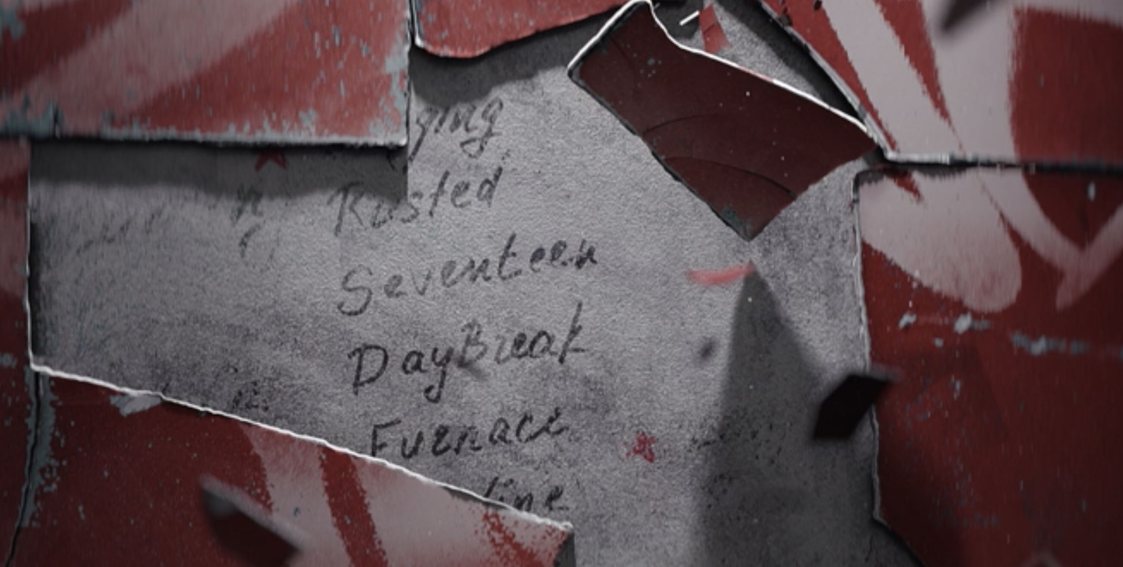 The words &quot;Seventeen. Daybreak&quot; appearing under peeling paper