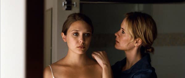 Martha/Marcy/Marlene looking in the mirror in Martha Marcy May Marlene