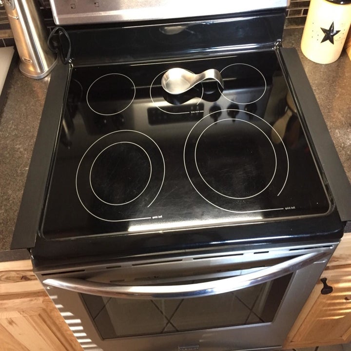 Reviewer photo of gap covers installed on sides of stove
