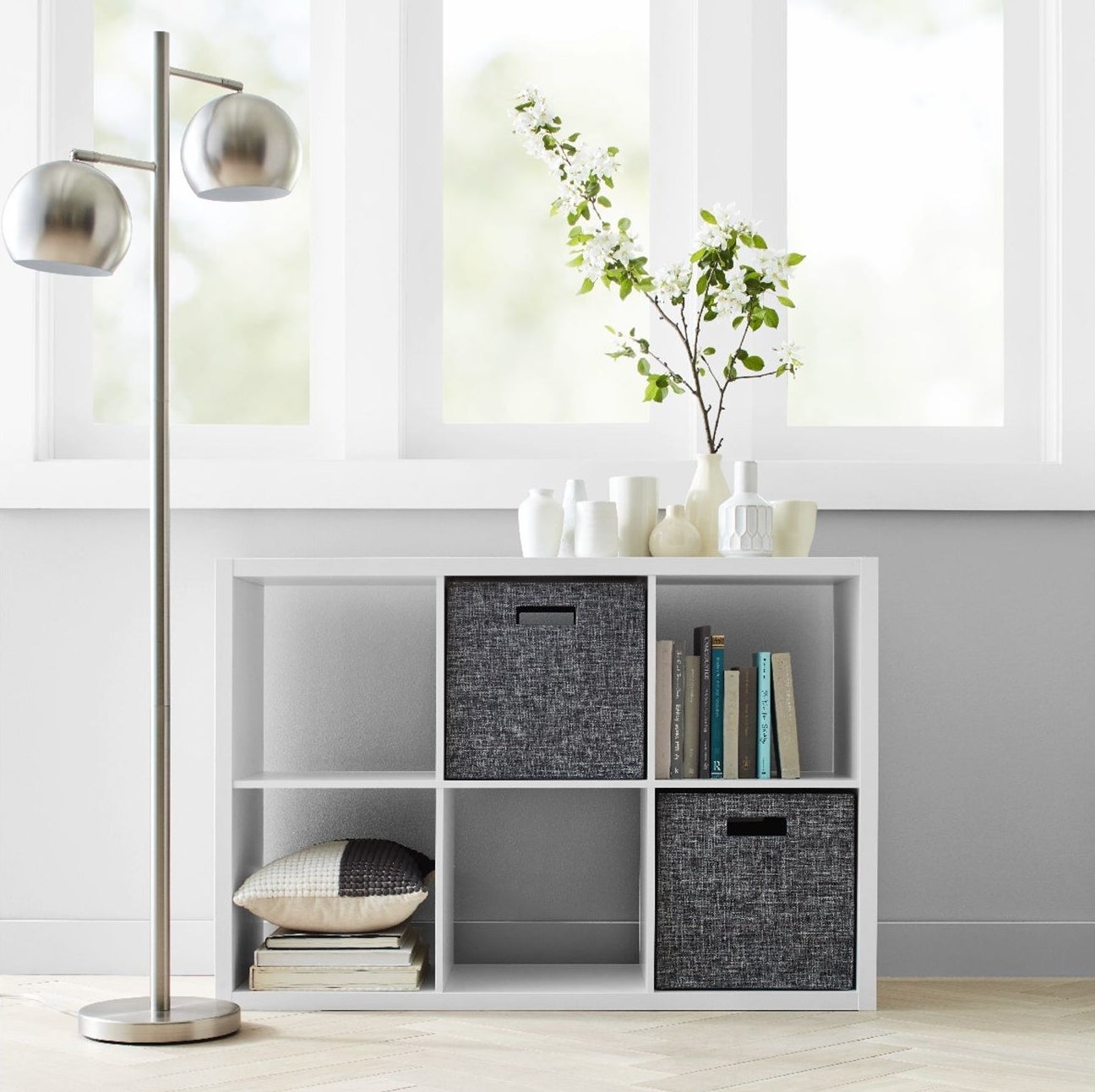 white six cube organizer shelf with books and grey cubes inside